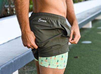 What are the advantages of wearing compression lined swim trunks during a workout routine?